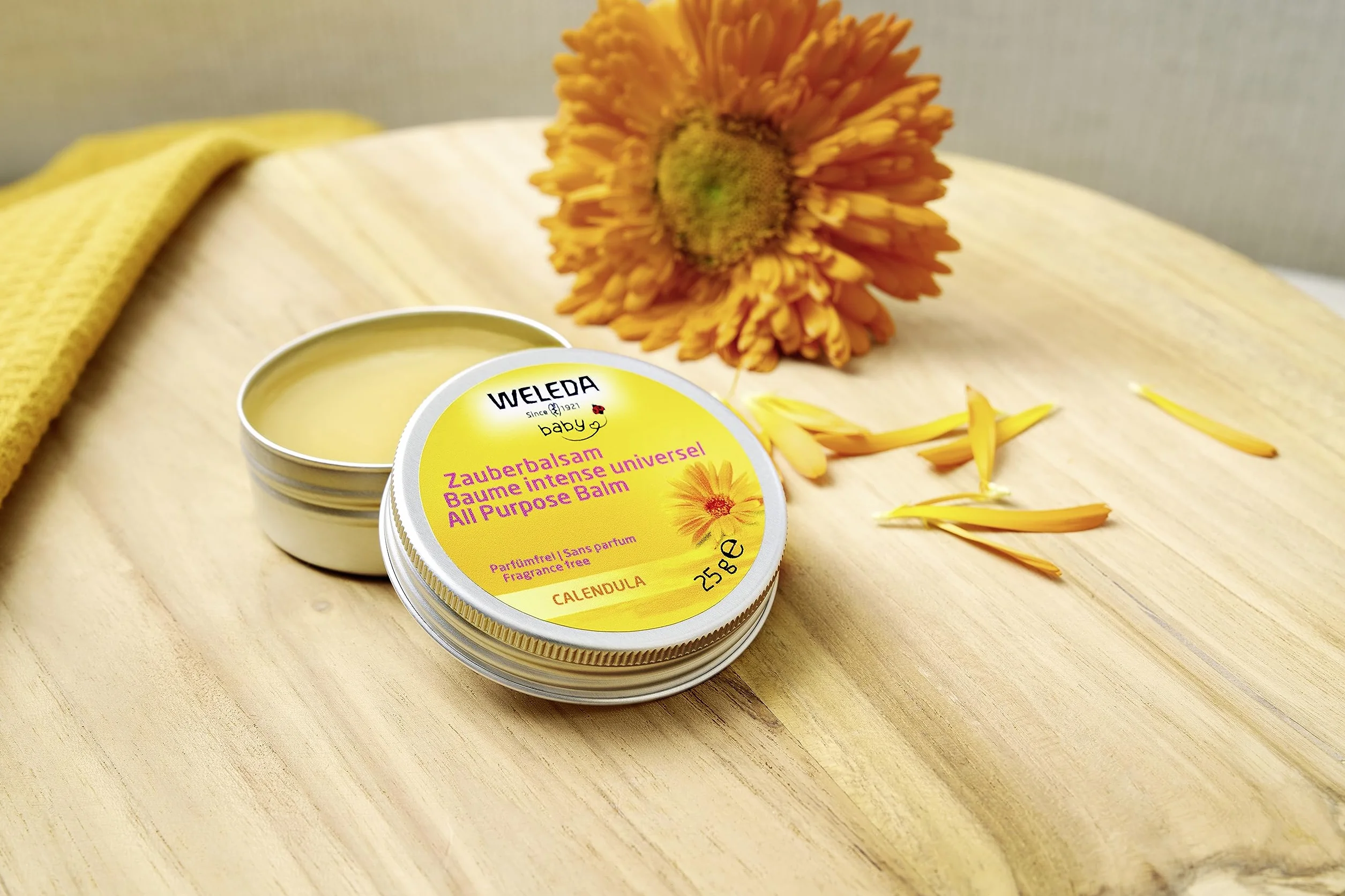WELEDA Bio Baby Calendula magiczny balsam – naturalny kosmetyk, uniwersalny balsam do twarzy i ciała do pielęgnacji i uspokajania suchej skóry i ust. Bogaty balsam uniwersalny dla niemowląt i dzieci (1 x 25 g)